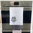 Ride More. Worry Less. Tea Towel